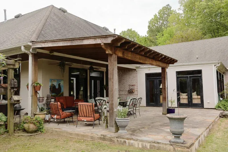 Beautiful pergola outdoor living space with a stamped concrete patio