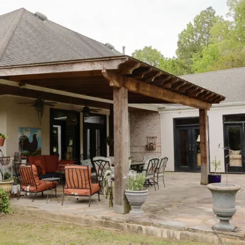 Beautiful pergola outdoor living space with a stamped concrete patio