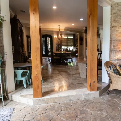 Custom doorway with a stamped concrete stone walkway